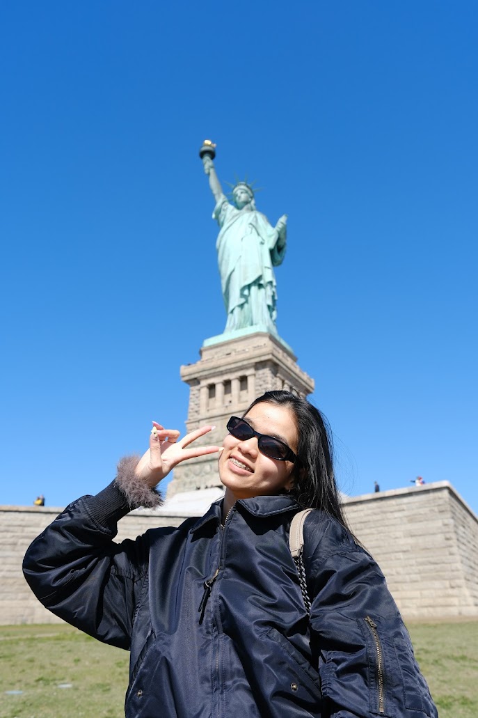 Jasmine in front of the Statue of Liberty
